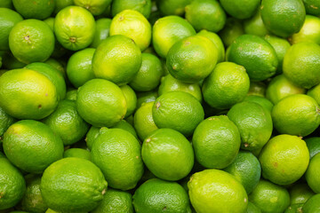 fresh ripe green lime as food background