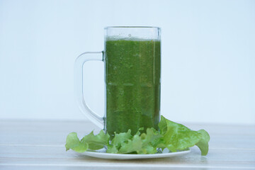 Green smoothie organic herbal vegetables in glass. Concept, healthy beverage for health. Well being...