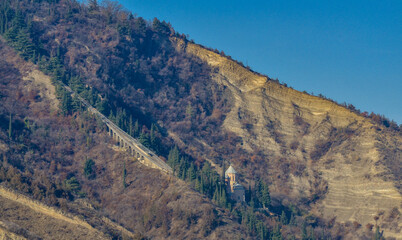 Fototapeta na wymiar Mamadaviti (St. Davids) Church and Tbilisi Funicular line on Mount Mtatsminda in Tbilisi, Georgia