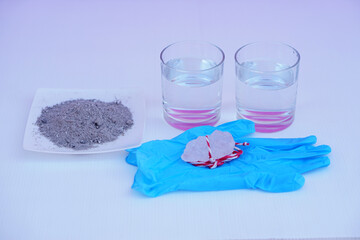 Equipment for doing science experiment about sedimentation by using alum stone with ash water in...