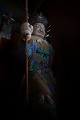 The colorful statue of a guard in Woljeongsa Temple is Located in a forested valley on the eastern side of Odaesan Mountain, South Korea. Korean traditional temple.