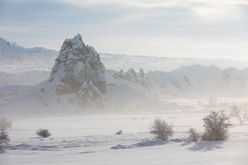 Pigeon Valley and Cave town in Göreme in winter, Fairy chimneys, Cappadocia, Turkey.