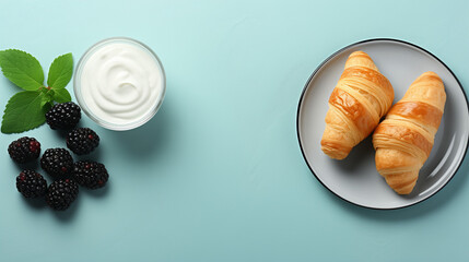 croissant on a plate, breakfast table. Milk on a pale blue background with fresh croissants on turquoise plates. upper view, copy area Yogurt pudding with chia seeds, mint leaves, fresh blackberries - obrazy, fototapety, plakaty