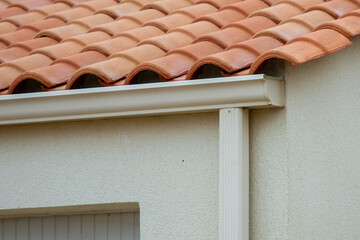 white gutter guard Metal Rainwater Systems fascia drip edge on single family home neighborhood