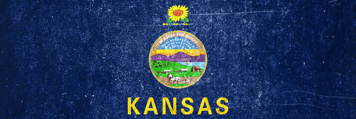 Banner of the grunge Kansas state flag. Dirty Kansas state flag on a metal surface.