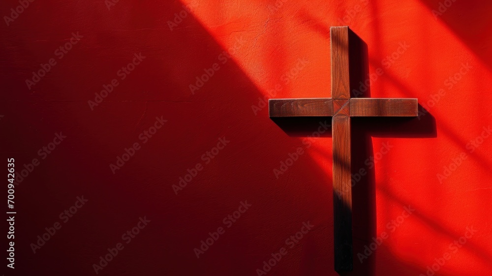 Aufkleber a cross on a red wall with a shadow of a cross on the side of the wall and a shadow of a cross on th