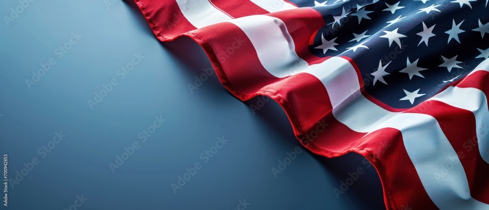 Poster a close up of an american flag on a blue background with space for a text or an image of an american
