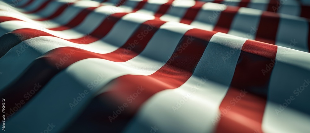 Poster a close up of a red and white striped surface with a blurry image of the top part of the surface.