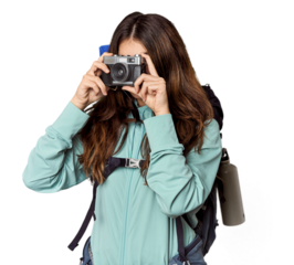 Young Caucasian woman with vintage camera and mountain gear
