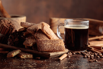 Sweet cinnamon cookies and a mug of black coffee.