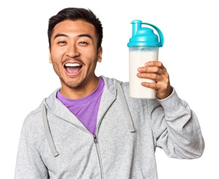 Fit Chinese male with protein shake and bottle in studio setup - Powered by Adobe