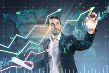 Attractive young european businessman with tablet using growing upward chart, map, arrows and forex graph on blurry background. Global trends, trading and finance concept. Double exposure. - Powered by Adobe
