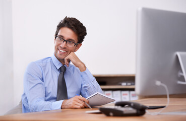 Businessman, thinking and smile for notes in notebook, contemplating ideas and pride in workplace....