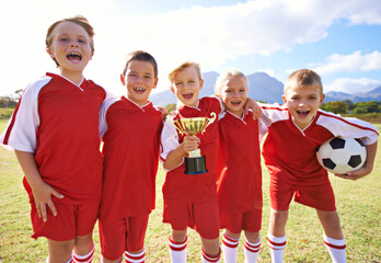 Victory, soccer team and children with cup, boys and girls with pride, support or proud....