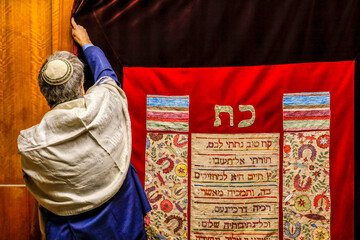 Rabbi closing a synagogue sacred ark curtain, Paris, France