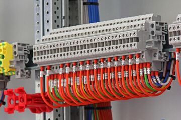 Electrical pass-through terminals for connecting copper mounting wires in an electrical distribution cabinet.