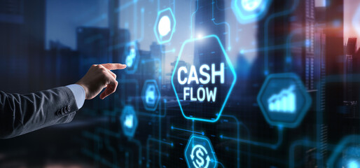 Fototapeta premium Cash flow button on virtual screen. Businessman drawing Cash Flow concept