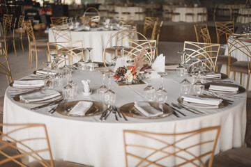 Wedding or dinner table decorated using autumn flowers