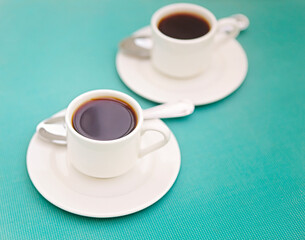 Cups of coffee on saucers