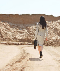 Business woman in a desert