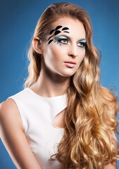 Naklejka premium Portrait of beautiful blond girl with make up