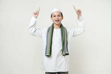 happy asian muslim man poitning finger gesture. People religious Islam lifestyle concept. celebration Ramadan and ied Mubarak. on isolated background.