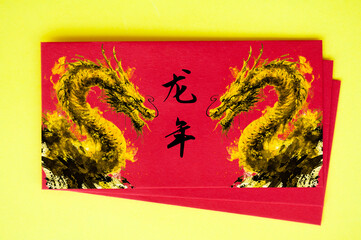 Top view of Chinese New Year red packet with golden dragons. Chinese New Year celebrations