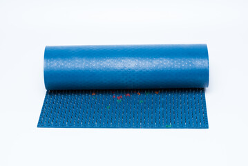 Lyapko applicator or acupuncture massage mat on white background. Alternative or unconventional medicine.