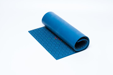 Lyapko applicator or acupuncture massage mat on white background. Alternative or unconventional medicine.