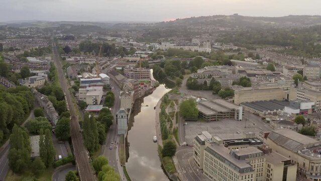 Bath UK aerial racking west along river Avon and train on railway United Kingdom