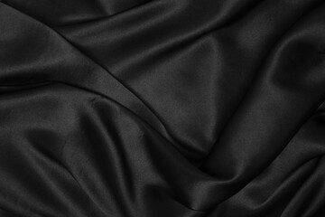 Part of the dark fabric texture of the fabric for the background and decoration of the work of art, a beautiful crumpled pattern of silk or linen. A crumpled piece of cloth - obrazy, fototapety, plakaty