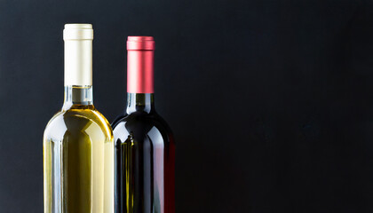 White and red wine on pure black background, copy space