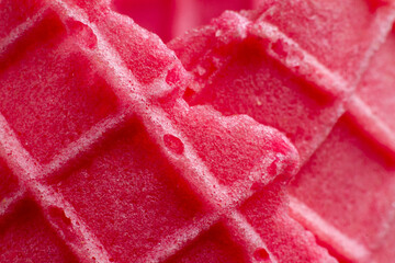 close of pink ice cream cone texture .