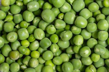 Fresh green top view peas background