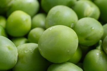 Fresh green top view peas background