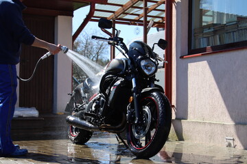 man wash motorcycle