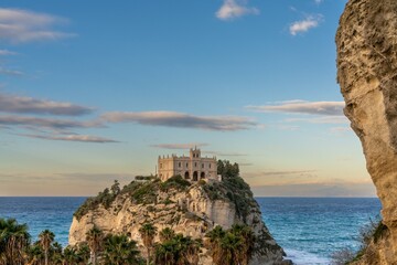 Fototapeta na wymiar view of the Santa Maria dell'Isola Church on its rocky promontory in Tropea at sunset