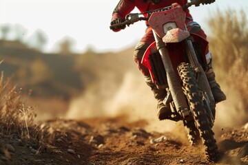 A person riding a dirt bike on a dirt road. Perfect for sports and adventure-themed projects