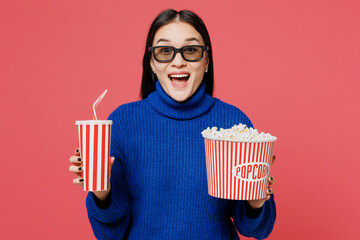 Young fun woman of Asian ethnicity she wear blue sweater casual clothes 3d glasses watch movie film...