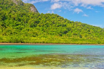 PALAWAN, PHILIPPINES - DECEMBER 21, 2023: Landscape of the beautiful mountain cliff in the sea, El Nido province in Palawan island in Philippines. 6 million tourists visited Philippines in 2016.