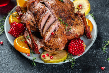 Whole roasted duck with oranges, berries and herbs. Dish for Christmas Eve. place for text