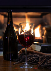 Glass of wine with fireplace in background - 701033495