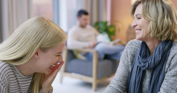 Laughing, coffee or mother talking to woman in conversation for gossip or bond in a family home. Funny, drinking tea or mature mom speaking to daughter or happy girl to relax in a discussion or chat