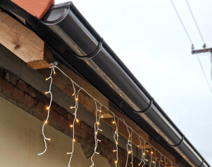 cable lights with led bulbs are suspended under the roof. it resembles icicles or frostbite. it...