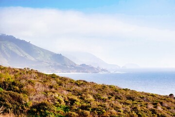 Fototapeta na wymiar Big Sur, United States - February 18 2020 : the picture shows an impressive panorama of the wild coast line at Big Sur
