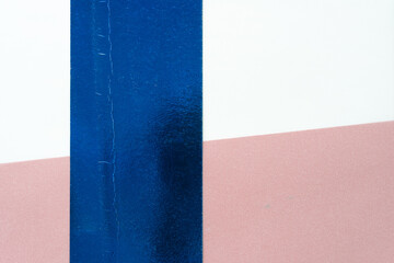 grungy metallic blue stripe on tracing paper with red backdrop element beneath