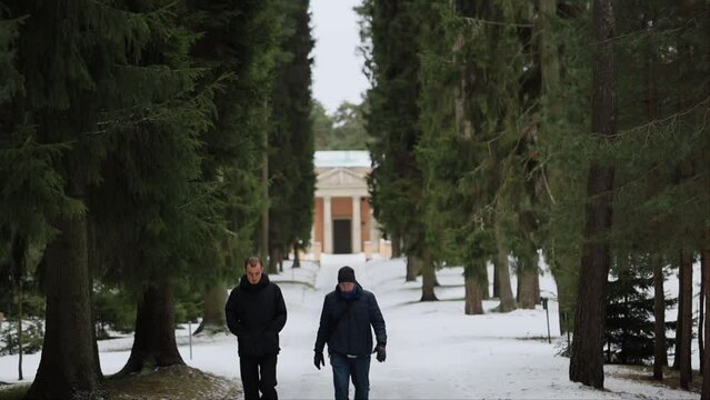 Stockholm, Sweden A father and son walk through the Woodland Cemetery, a Unesco World Heritage site, in winter. 