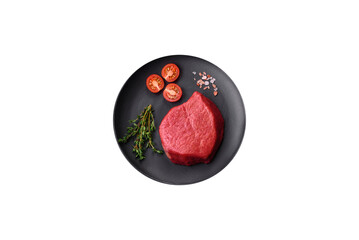 Fresh juicy raw filet mignon with salt, spices and herbs