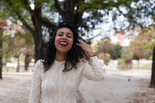 A stolen shot of pretty girl with a shocked hand gesture and a surprised facial expression.
