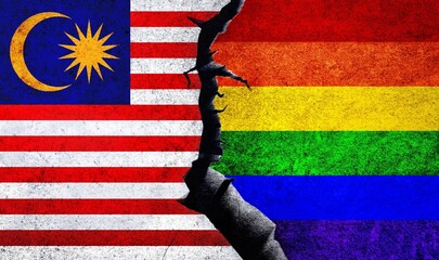 Malaysia and Rainbow flags on a wall with crack. Homosexuality in Malaysia. Malaysia and LGBTQ relation, rights, freedom, pride, conflict concept